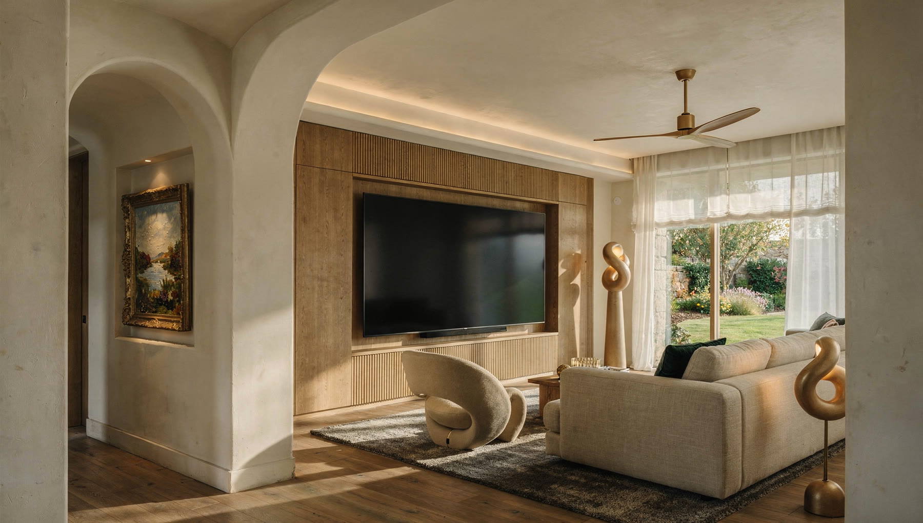 A warm, softly lit show-home lounge at the Meshronix experience centre, with a garden view and cove lighting